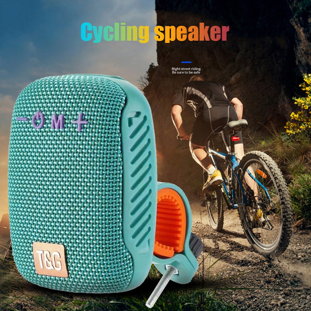 Caixa de Som com Suporte T&G Bluetooth e FM | BRINDE CASE IMPERMEÁVEL